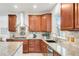 Close up of a modern kitchen with granite countertops and stainless appliances at 13971 Star Creek Dr, Broomfield, CO 80023