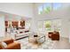 Open-concept living room with high ceilings and natural light at 13971 Star Creek Dr, Broomfield, CO 80023