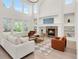 Spacious living room with a cozy fireplace, soaring ceilings, and an open layout perfect for entertaining at 13971 Star Creek Dr, Broomfield, CO 80023