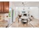 Open layout combining kitchen with a living room featuring high ceilings and fireplace at 13971 Star Creek Dr, Broomfield, CO 80023