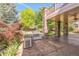 Outdoor kitchen area with built in grill, sink, and a covered patio at 13971 Star Creek Dr, Broomfield, CO 80023