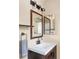 Stylish bathroom vanity with modern fixtures, decorative mirrors, and ample lighting at 4619 S Tabor Way, Morrison, CO 80465