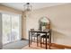 Cozy dining area with dark wood table and chairs, sliding door access to the backyard at 4619 S Tabor Way, Morrison, CO 80465