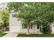 Charming two-story home with a well-manicured lawn, an attached garage, and lovely curb appeal at 4619 S Tabor Way, Morrison, CO 80465