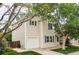 An exterior view of a charming two-story home, featuring vinyl siding, an attached garage and a well-kept lawn at 4619 S Tabor Way, Morrison, CO 80465