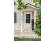 Inviting front entrance with a 'Welcome' sign, complementing the home's exterior and landscaped surroundings at 4619 S Tabor Way, Morrison, CO 80465