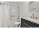 Bright bathroom featuring a shower-tub combination and vanity with modern fixtures at 1179 S Fultondale Cir, Aurora, CO 80018