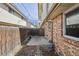 Fenced backyard with patio, wood fence, rocks and mulch at 4655 Independence St # 3, Wheat Ridge, CO 80033