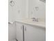 A well-lit bathroom with a white vanity, mirror, and chrome fixtures at 4655 Independence St # 3, Wheat Ridge, CO 80033