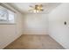 Bright bedroom featuring a ceiling fan, carpet, and a window at 4655 Independence St # 3, Wheat Ridge, CO 80033