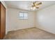 Bedroom with a ceiling fan, carpet, and a closet at 4655 Independence St # 3, Wheat Ridge, CO 80033