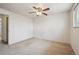 A spacious bedroom featuring neutral carpet and a ceiling fan at 4655 Independence St # 3, Wheat Ridge, CO 80033