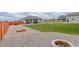 Landscaped backyard featuring a gravel area, fire pit, and patio with outdoor furniture at 16516 Fairbanks Rd, Platteville, CO 80651