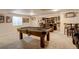 Finished basement with a pool table, a bar area, and a cozy lounge area at 16516 Fairbanks Rd, Platteville, CO 80651
