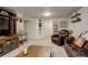 A comfortable basement space with an entertainment center and neutral carpeting at 16516 Fairbanks Rd, Platteville, CO 80651
