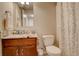 Bathroom features a stylish vanity with granite countertops, and tiled floors at 16516 Fairbanks Rd, Platteville, CO 80651