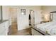 Spacious bedroom provides access to the en-suite bathroom and other rooms, offering both privacy and accessibility at 16516 Fairbanks Rd, Platteville, CO 80651