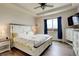 Serene bedroom with tray ceiling, wood floors, and a large window with serene natural light at 16516 Fairbanks Rd, Platteville, CO 80651