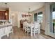 Bright dining area with natural light, wood floors and direct access to the kitchen at 16516 Fairbanks Rd, Platteville, CO 80651