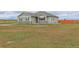 Exterior view of a single-Gathering home featuring a well-maintained lawn at 16516 Fairbanks Rd, Platteville, CO 80651