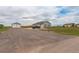 A beautiful house with a detached garage and a driveway at 16516 Fairbanks Rd, Platteville, CO 80651