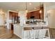 Spacious kitchen with granite island, breakfast bar, pendant lighting and stainless steel appliances at 16516 Fairbanks Rd, Platteville, CO 80651