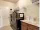 Well-equipped laundry room with modern washer and dryer, offering convenience and efficiency at 16516 Fairbanks Rd, Platteville, CO 80651