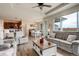 Living room flows into dining area and kitchen, featuring hardwood floors and great light at 16516 Fairbanks Rd, Platteville, CO 80651