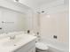 Neutral bathroom featuring a shower-tub combo and ample lighting at 10150 E Virginia Ave # 4-104, Denver, CO 80247