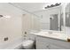 Clean bathroom featuring a shower-tub combo, vanity, and neutral decor at 10150 E Virginia Ave # 4-104, Denver, CO 80247
