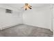 Bright bedroom with neutral carpet, a ceiling fan, and sunny window at 10150 E Virginia Ave # 4-104, Denver, CO 80247