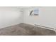 Bright bedroom with neutral carpet, a large window, and closet at 10150 E Virginia Ave # 4-104, Denver, CO 80247