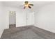 Cozy bedroom featuring neutral carpet, a ceiling fan, and ample space at 10150 E Virginia Ave # 4-104, Denver, CO 80247