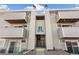 Attractive condo building exterior showing multiple levels, balconies and entry stairs at 10150 E Virginia Ave # 4-104, Denver, CO 80247