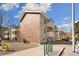 Brick and siding apartment building with private balconies and xeriscaping at 10150 E Virginia Ave # 4-104, Denver, CO 80247