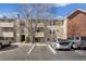 Apartment building with dedicated parking spaces near the units at 10150 E Virginia Ave # 4-104, Denver, CO 80247