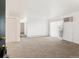 Spacious living room with plush carpeting, sliding glass doors, and ample natural light at 10150 E Virginia Ave # 4-104, Denver, CO 80247