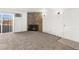 Inviting living room features a stone fireplace and access to outdoor space at 10150 E Virginia Ave # 4-104, Denver, CO 80247