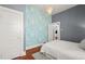 Bedroom featuring bright wallpaper and a chandelier at 3320 N Columbine St, Denver, CO 80205