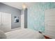 Bedroom featuring bright wallpaper and a chandelier at 3320 N Columbine St, Denver, CO 80205