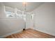 White room with wood-look floors featuring natural light and clean lines at 3320 N Columbine St, Denver, CO 80205