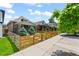 Landscaped front yard of the house highlighting its charming fence and curb appeal at 3320 N Columbine St, Denver, CO 80205