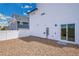 Fenced backyard features low-maintenance gravel and a convenient access door at 5147 N Waco St, Denver, CO 80249