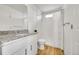 Clean bathroom featuring white fixtures and a granite countertop at 5147 N Waco St, Denver, CO 80249