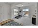 Bright room with a treadmill, sliding doors to an outdoor patio, and ample natural light at 5147 N Waco St, Denver, CO 80249