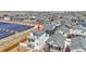 New construction home with a white exterior, two balconies, adjacent to a solar field in a residential community at 5147 N Waco St, Denver, CO 80249