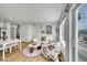 Cozy living area filled with natural light, featuring stylish furniture, hardwood floors, and white walls at 5147 N Waco St, Denver, CO 80249