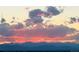Beautiful skyline view featuring colorful clouds over mountain silhouette at 5147 N Waco St, Denver, CO 80249