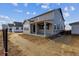 Home exterior displays a covered patio and backyard, perfect for outdoor living at 25214 E Warren Pl, Aurora, CO 80018