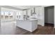 Well-lit modern kitchen boasting stainless steel appliances and a center island for easy meal preparation at 25214 E Warren Pl, Aurora, CO 80018